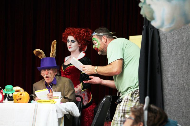 From left: Jackson Gillman, Mary Bruce and Peter Teitelbaum act out a scene from “The Mad Tea Party” in October. The show, which included actors from various town and community groups, raised money for the Wareham Free Library Foundation. BY MATTHEW BERNAT